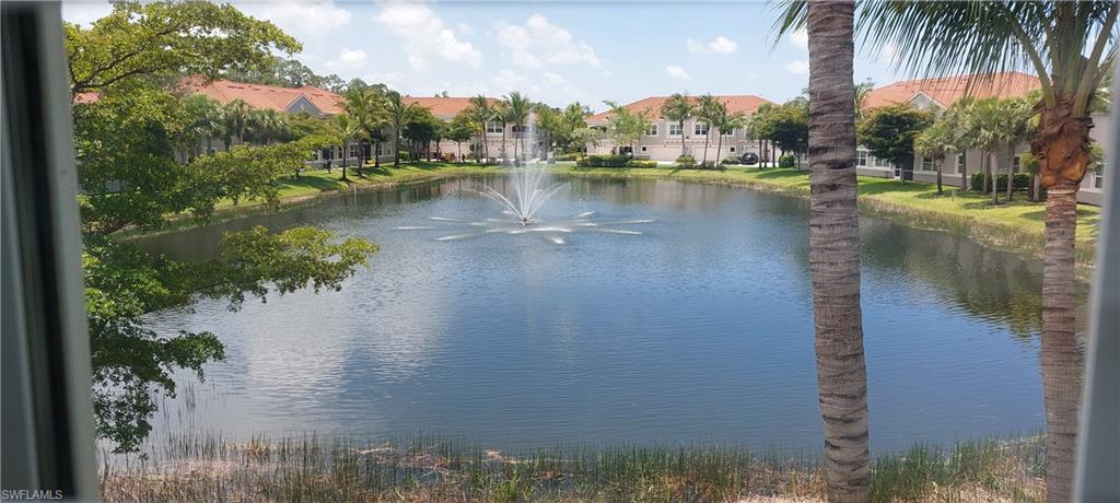 8561 Violeta Street, Unit 202 Estero, FL 34135 - Photo 8 of 40 a view of a lake with houses in front of it
