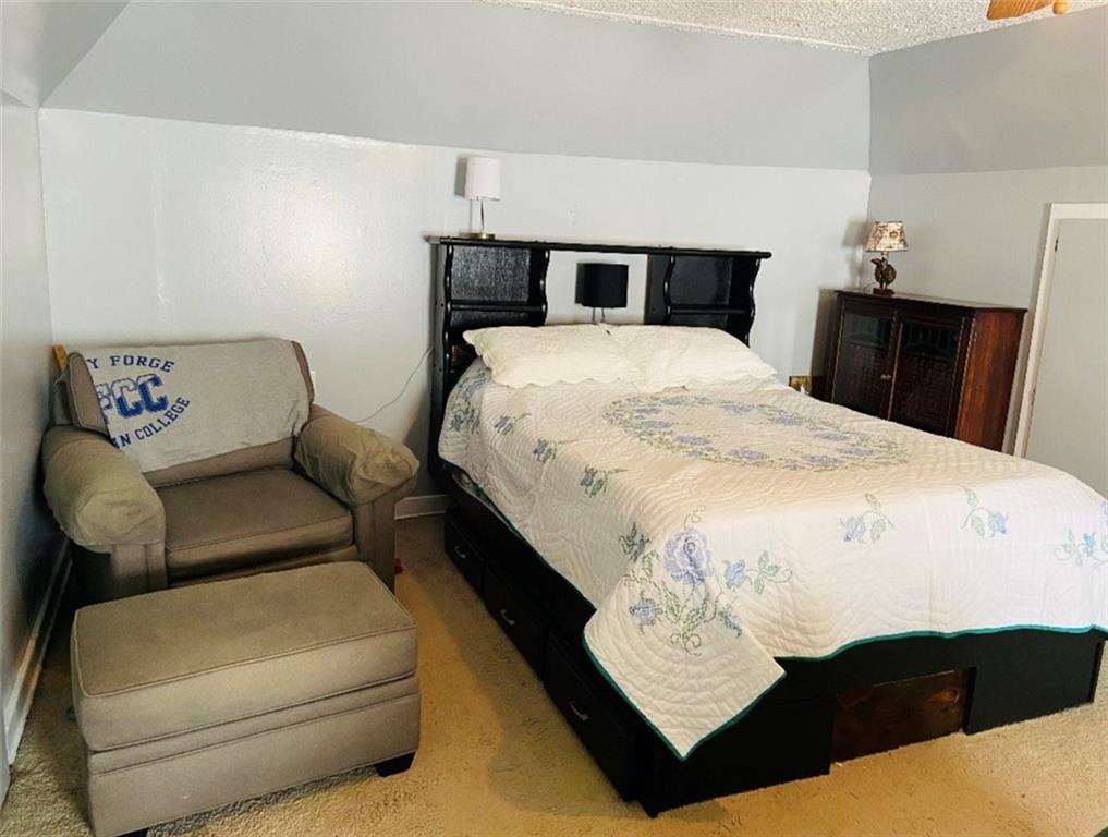 518 Walnut Avenue Scottdale, PA 15683 - Photo 23 of 28 a bed sitting in a bedroom next to a window