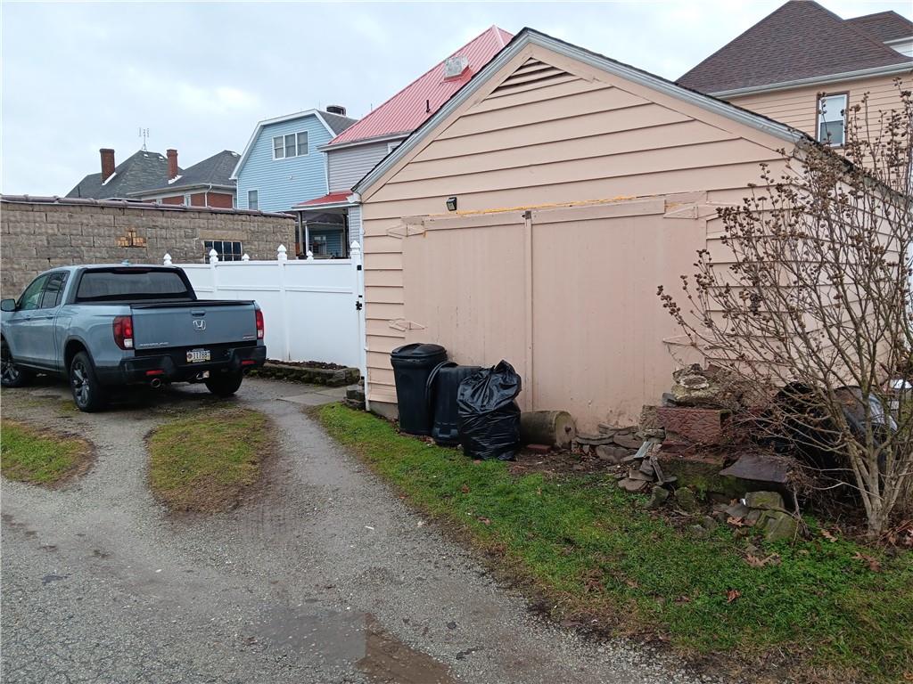 518 Walnut Avenue Scottdale, PA 15683 - Photo 27 of 28 a car parked in front of a house
