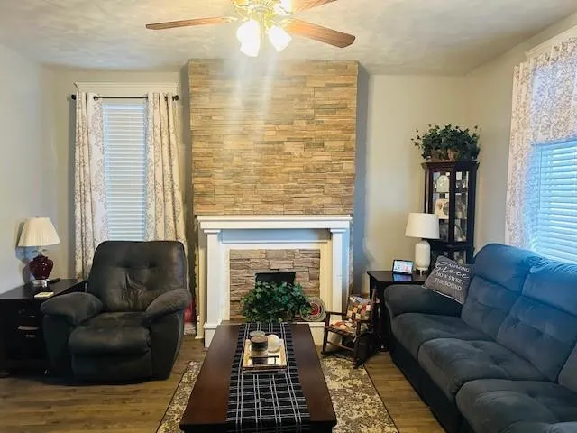 a living room with furniture and a fireplace