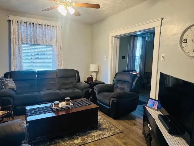 a living room with furniture and a flat screen tv