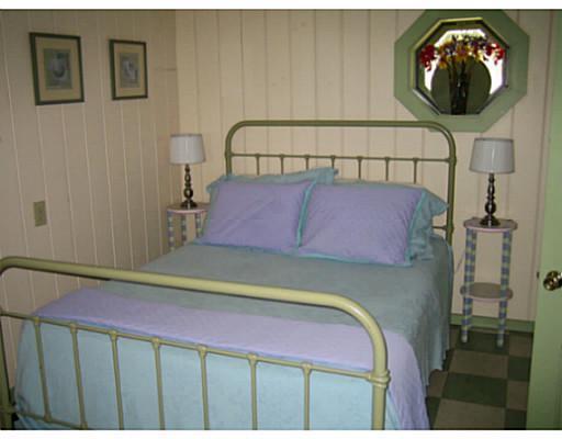 459 Ocean Point Road East Boothbay, ME 04544 - Photo 15 of 17 Bedroom. Green cottage bedroom