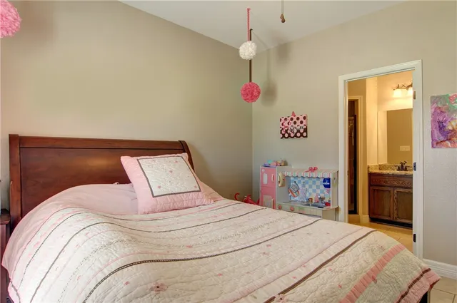 a bedroom with a bed and a dresser