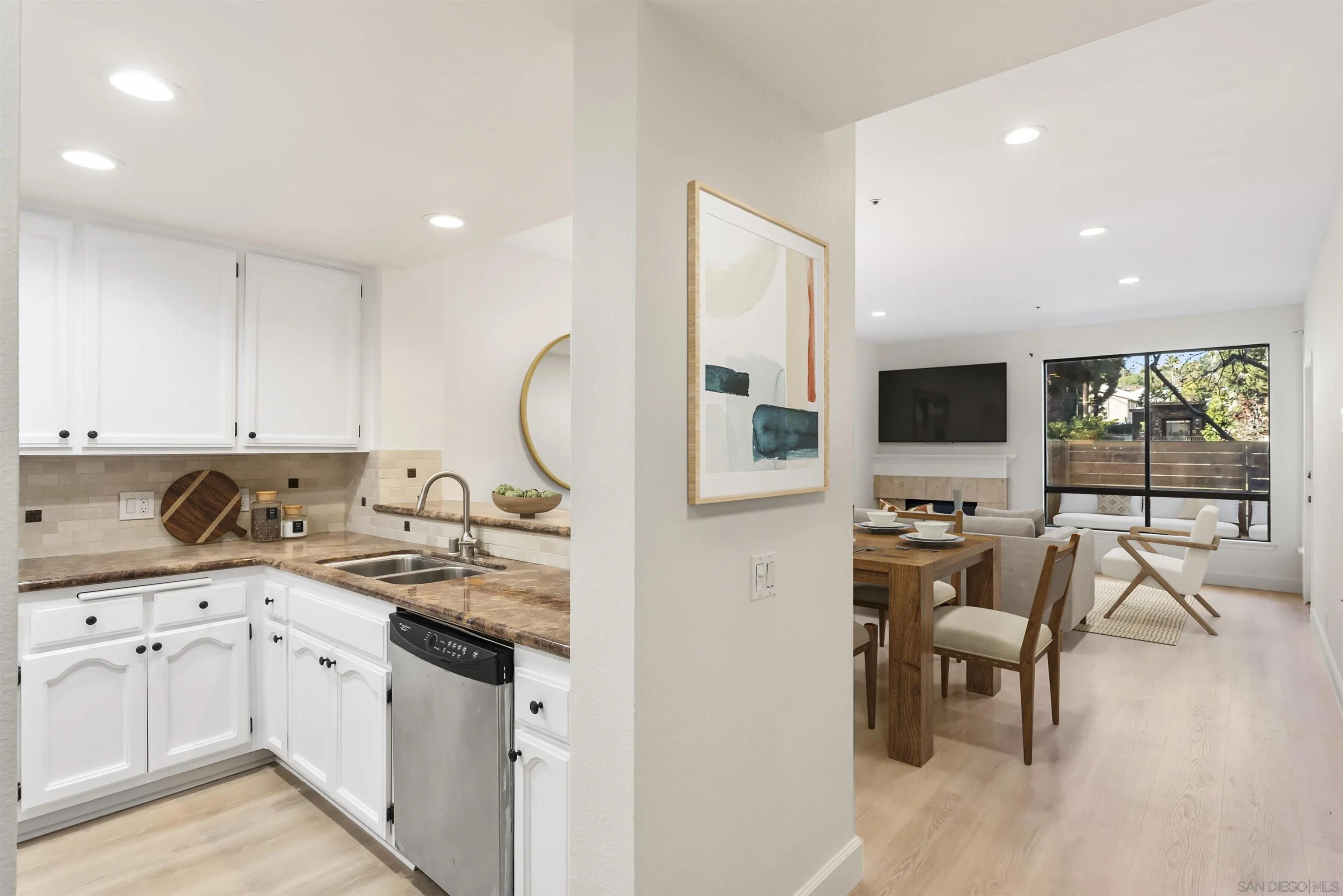 5805 Friars Road, Unit 2115 San Diego, CA 92110 - Photo 14 of 16 a kitchen that has a lot of cabinets in it and appliances