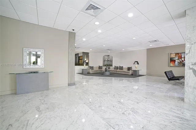 a view of a livingroom with furniture and a window