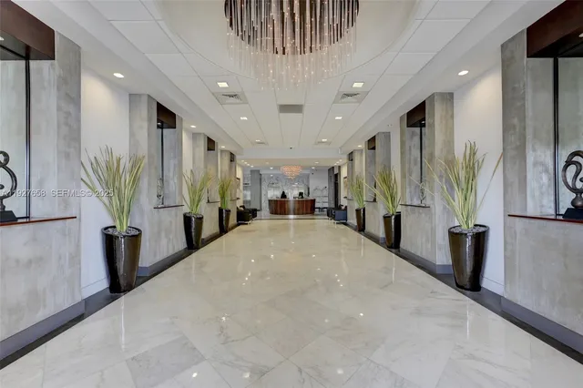 a view of livingroom with furniture and a hallway