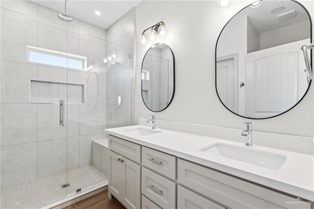 2102 Trinity Street Donna, TX 78537 - Photo 12 of 24 a bathroom with 2 sink and a mirror