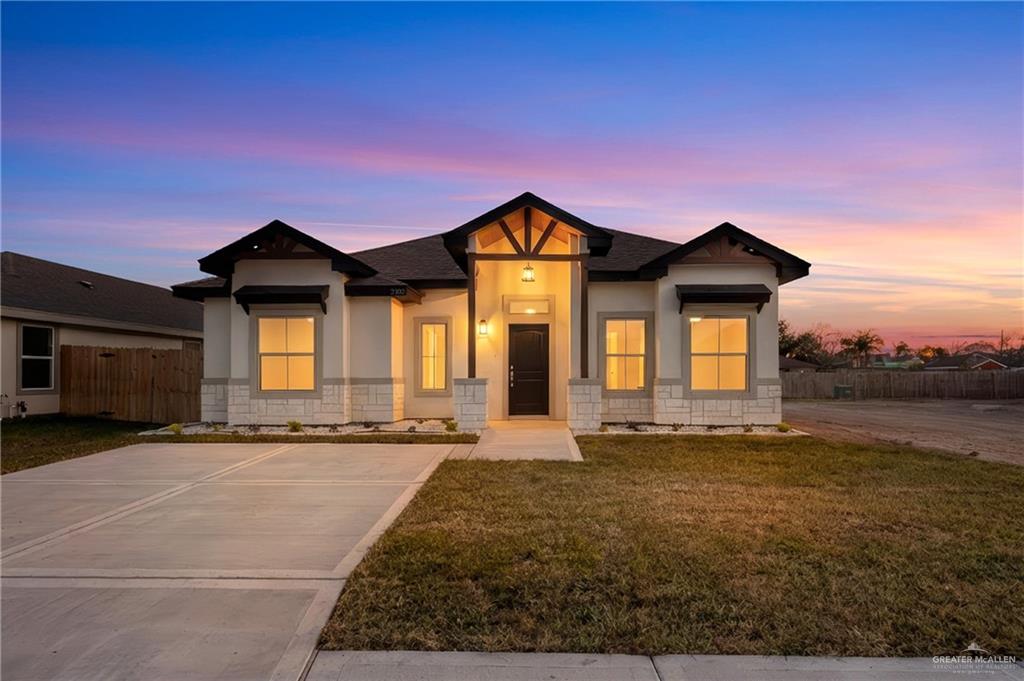 2102 Trinity Street Donna, TX 78537 - Photo 2 of 24 a front view of a house with a yard