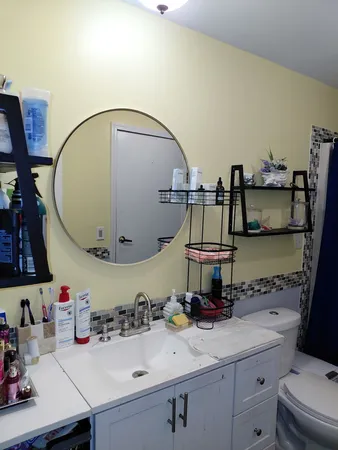 a bathroom with a sink and a mirror