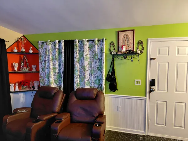 a living room with furniture and a window