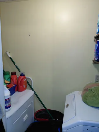 a room with a rug and closet