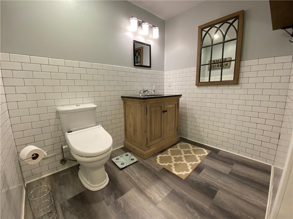 2300 Beallsville Road Marianna, PA 15345 - Photo 17 of 25 a bathroom with a toilet a sink a mirror and window