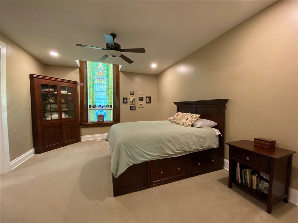 2300 Beallsville Road Marianna, PA 15345 - Photo 21 of 25 a spacious bedroom with a bed and a chandelier