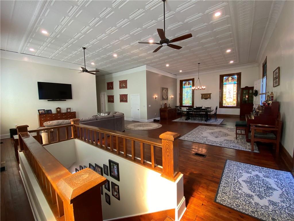 2300 Beallsville Road Marianna, PA 15345 - Photo 22 of 25 a kitchen with stainless steel appliances granite countertop a sink dishwasher a dining table and chairs with wooden floor