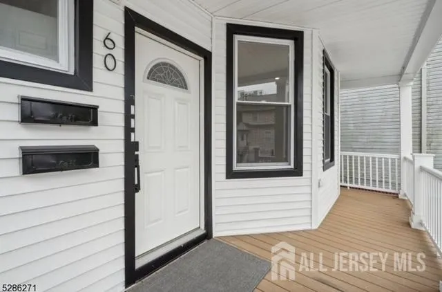 a view of a door of a house with a balcony