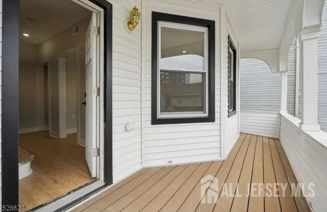 a view of a wooden door with a balcony