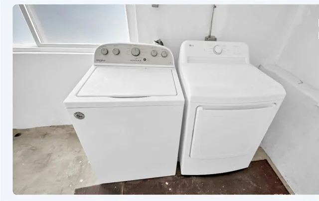 a utility room with dryer and washer