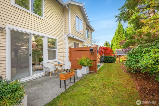 a wooden bench sitting in front of a house