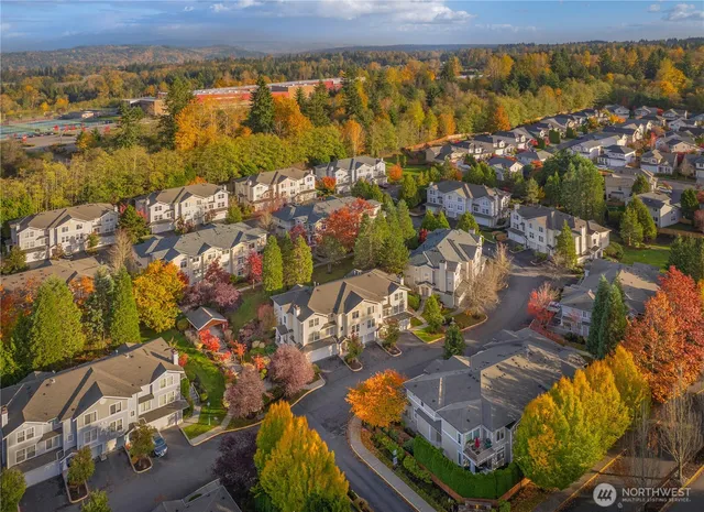 an aerial view of residential houses with outdoor space