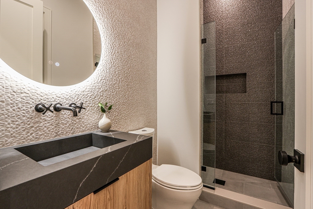 189 Hartman Road Newton, MA 02459 - Photo 12 of 38 a bathroom with a toilet and a sink
