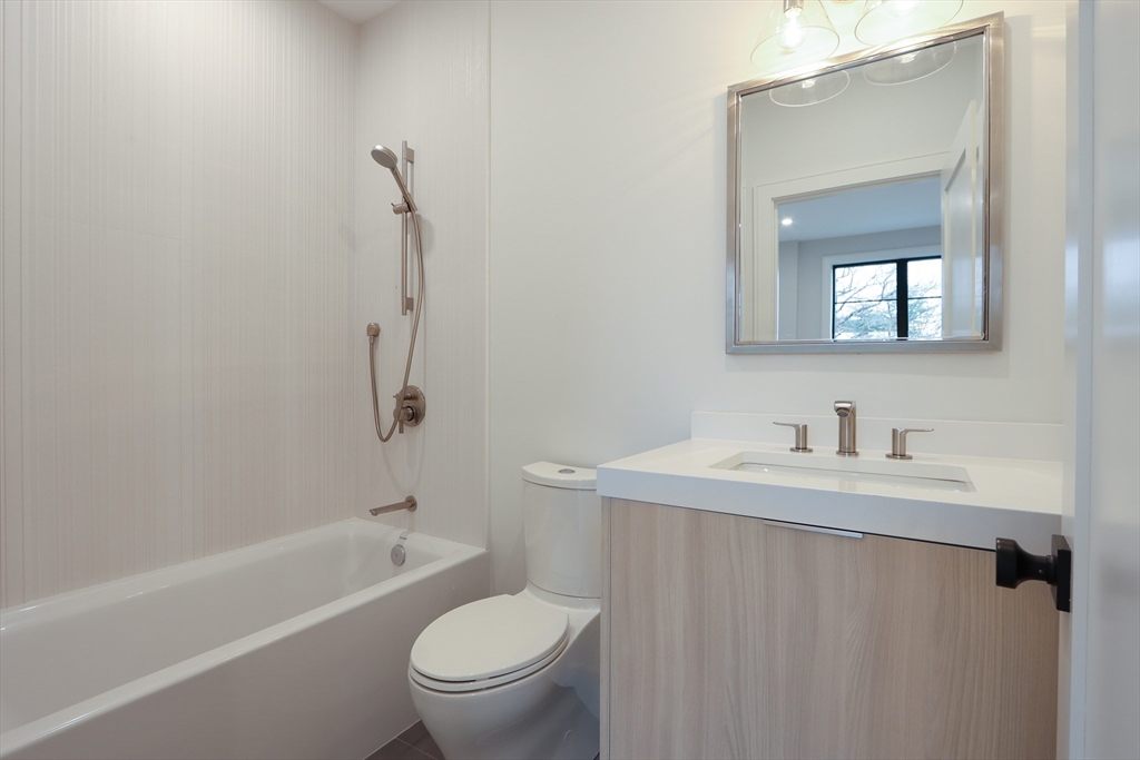 189 Hartman Road Newton, MA 02459 - Photo 15 of 38 a bathroom with a sink a toilet and shower