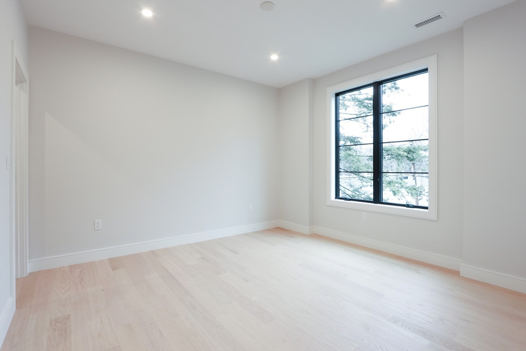 189 Hartman Road Newton, MA 02459 - Photo 17 of 38 an empty room with a window