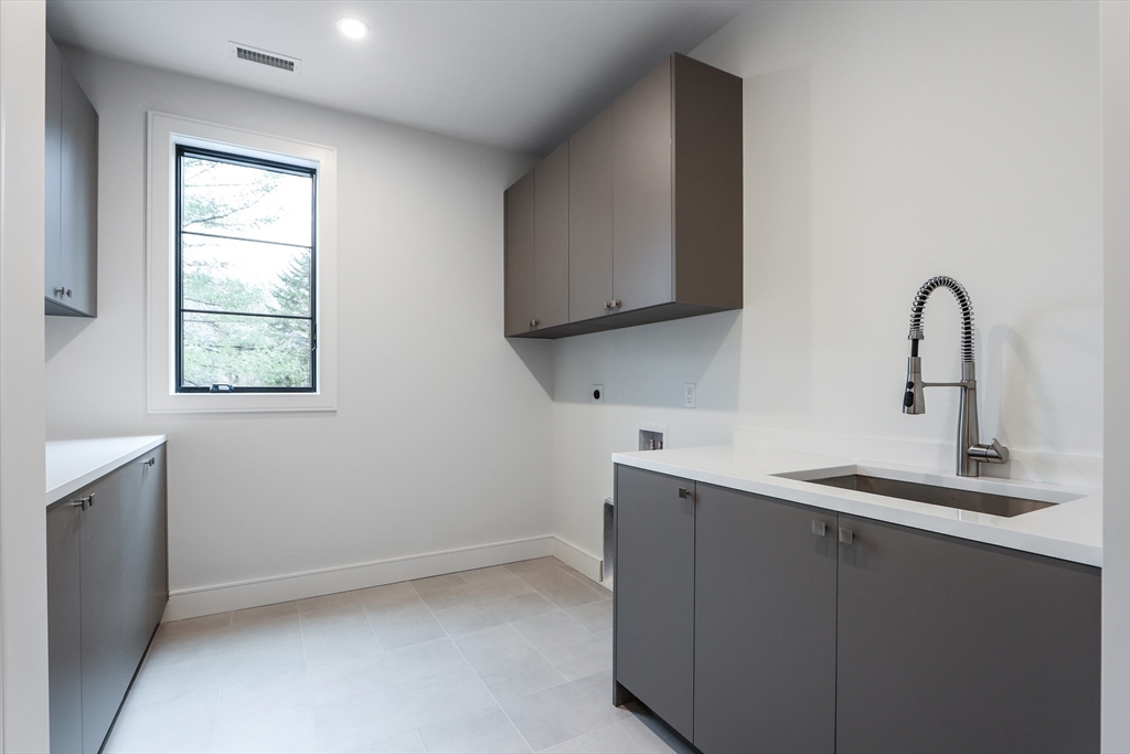 189 Hartman Road Newton, MA 02459 - Photo 19 of 38 a kitchen with a sink and a window