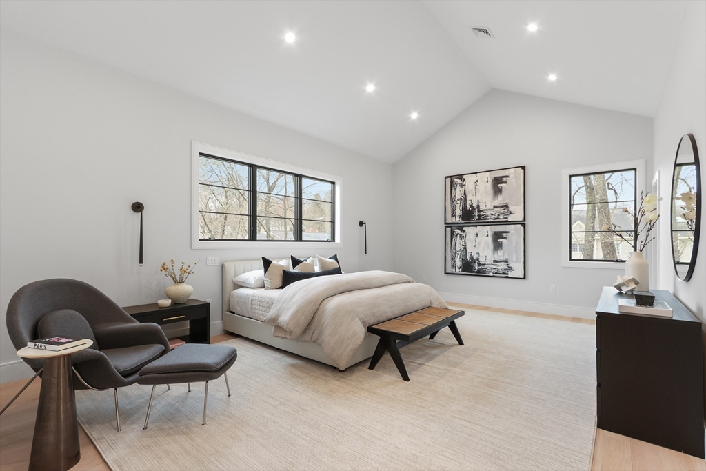 189 Hartman Road Newton, MA 02459 - Photo 20 of 38 a spacious bedroom with two beds and a couch