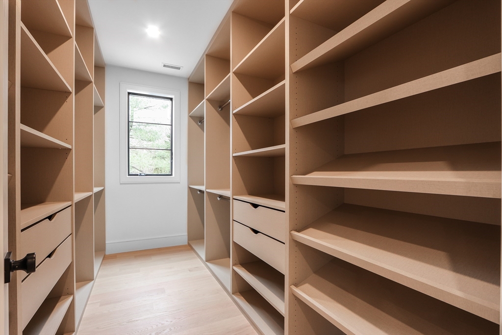 189 Hartman Road Newton, MA 02459 - Photo 22 of 38 a view of an empty room with wooden floor and a window