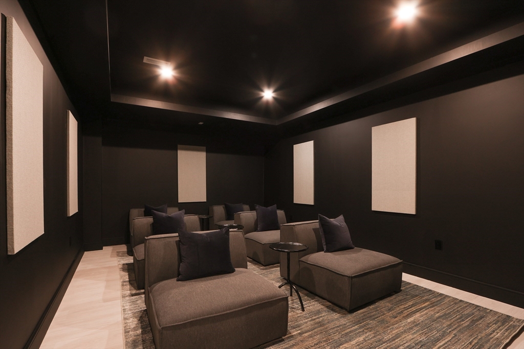 189 Hartman Road Newton, MA 02459 - Photo 32 of 38 a media room with lots of chairs and a projector