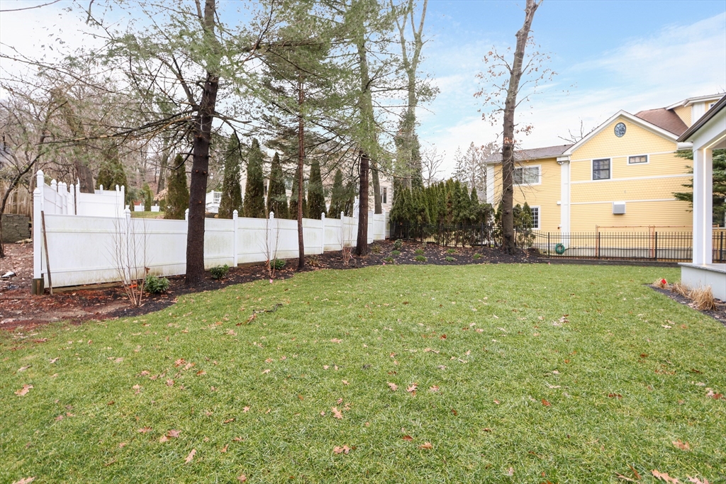 189 Hartman Road Newton, MA 02459 - Photo 35 of 38 a view of a house with a big yard and large tree