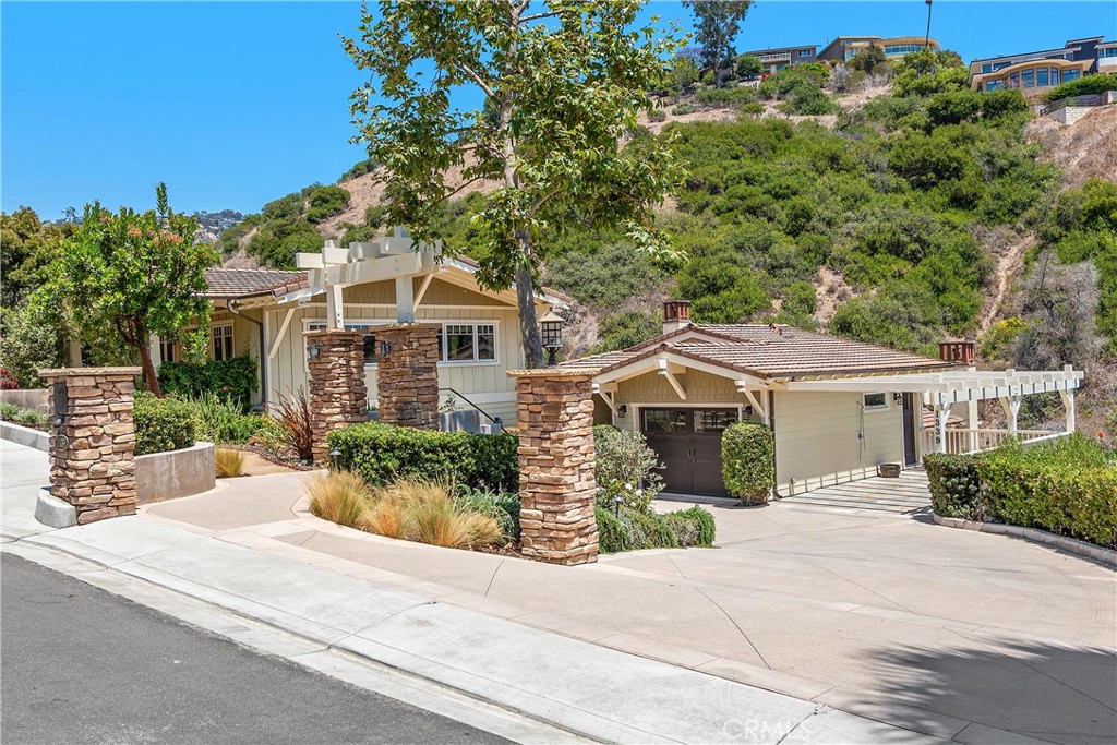1339 Dunning Drive Laguna Beach, CA 92651 - Photo 2 of 42 front view of a house with a bench