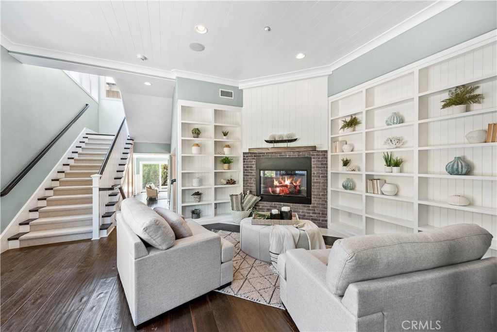 1339 Dunning Drive Laguna Beach, CA 92651 - Photo 26 of 42 a living room with furniture a flat screen tv and a fireplace