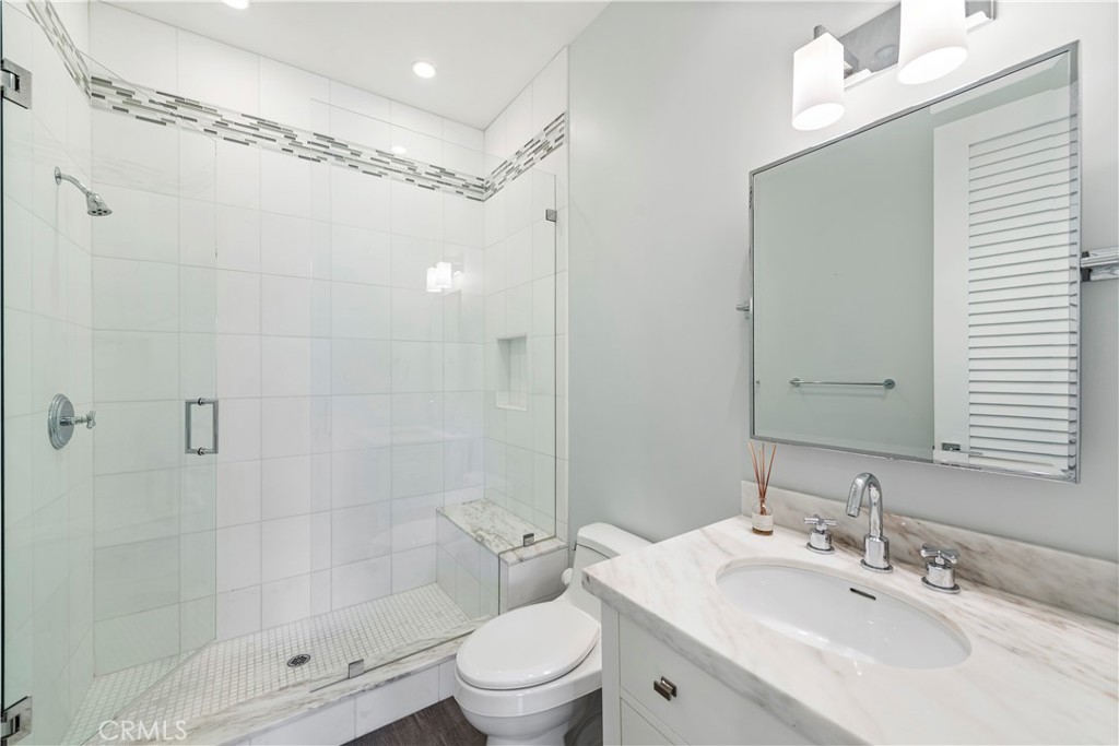 1339 Dunning Drive Laguna Beach, CA 92651 - Photo 30 of 42 a bathroom with a sink a toilet and shower