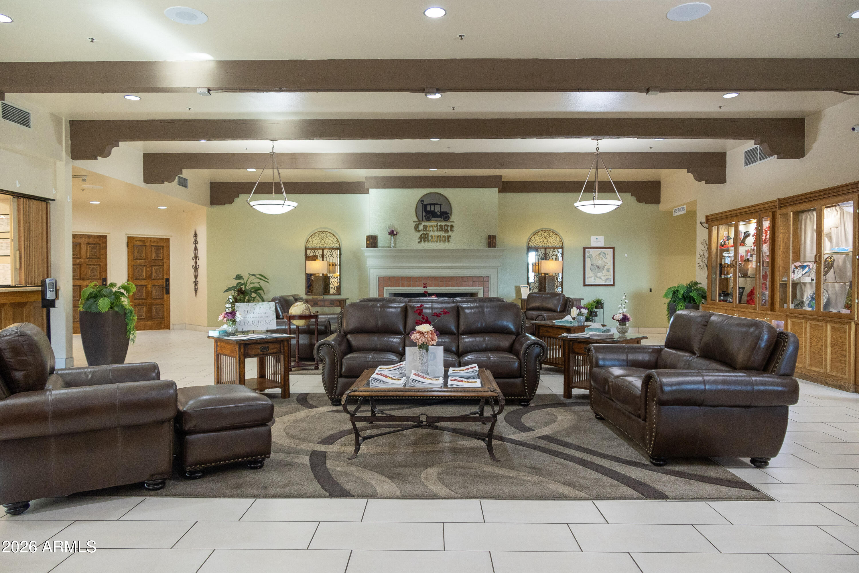 7750 East Broadway Road, Unit 300 Mesa, AZ 85208 - Photo 8 of 25 a living room with furniture and a large window