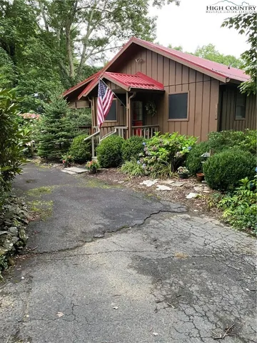 a front view of a house with yard