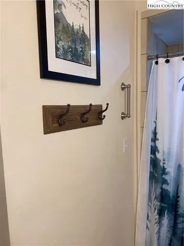 a close up of a wall with a shower