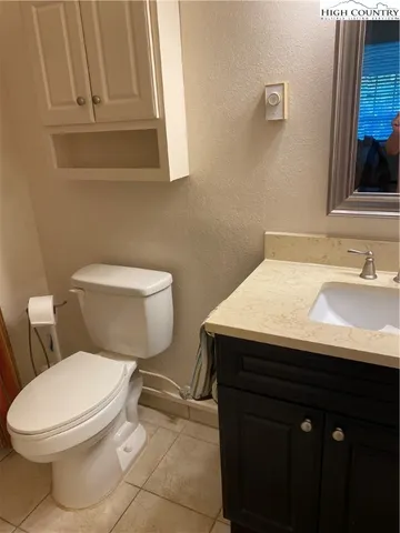 a bathroom with a sink toilet and vanity