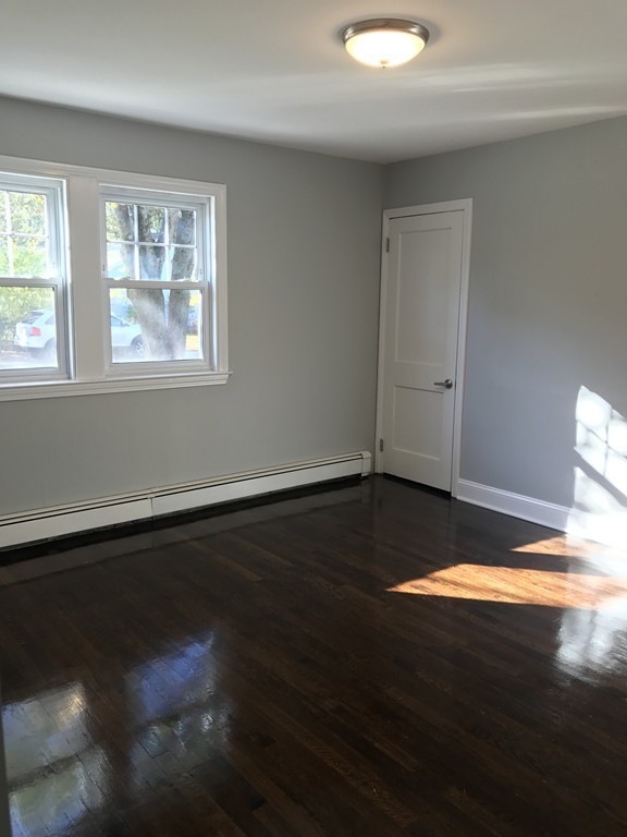 20 Selwyn Road Randolph, MA 02368 - Photo 11 of 20 a view of a livingroom with wooden floor and a window