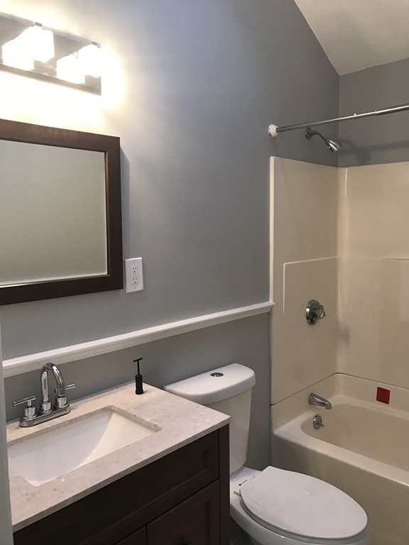 20 Selwyn Road Randolph, MA 02368 - Photo 12 of 20 a bathroom with a sink a toilet and bathtub