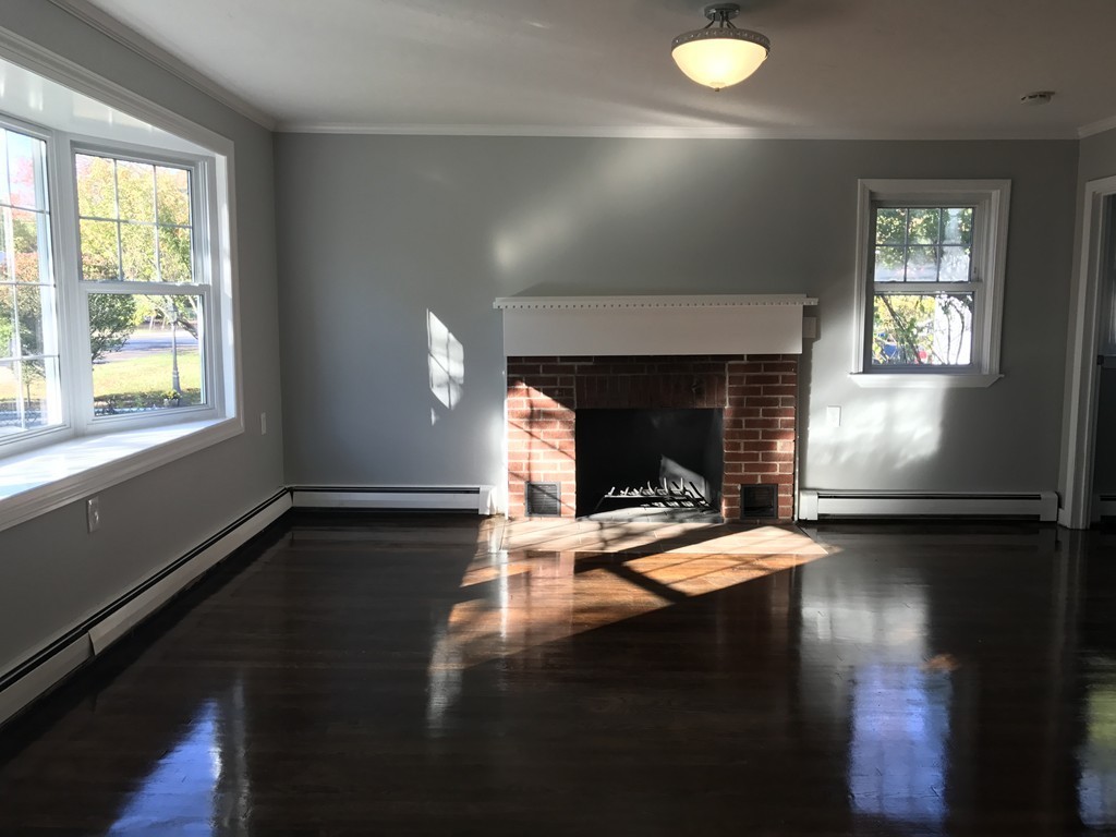 20 Selwyn Road Randolph, MA 02368 - Photo 3 of 20 a view of a livingroom with furniture and a fireplace