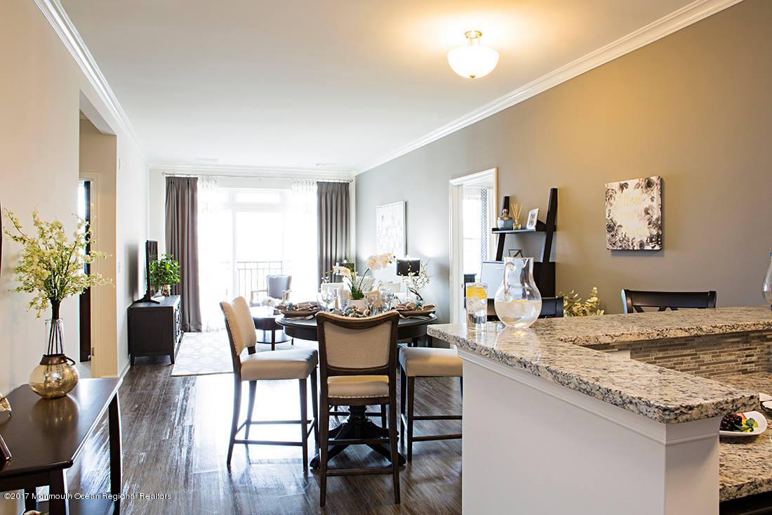 249 Broad Street, Unit 330 Matawan, NJ 07747 - Photo 25 of 27 a view of a dining room with furniture and wooden floor
