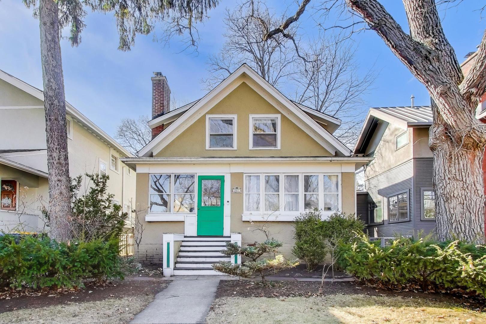 207 5th Street Wilmette, IL 60091 - Photo 1 of 30 a front view of a house with garden