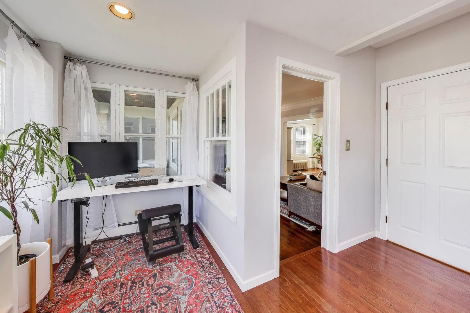 207 5th Street Wilmette, IL 60091 - Photo 15 of 30 a view of a workspace with furniture and wooden floor
