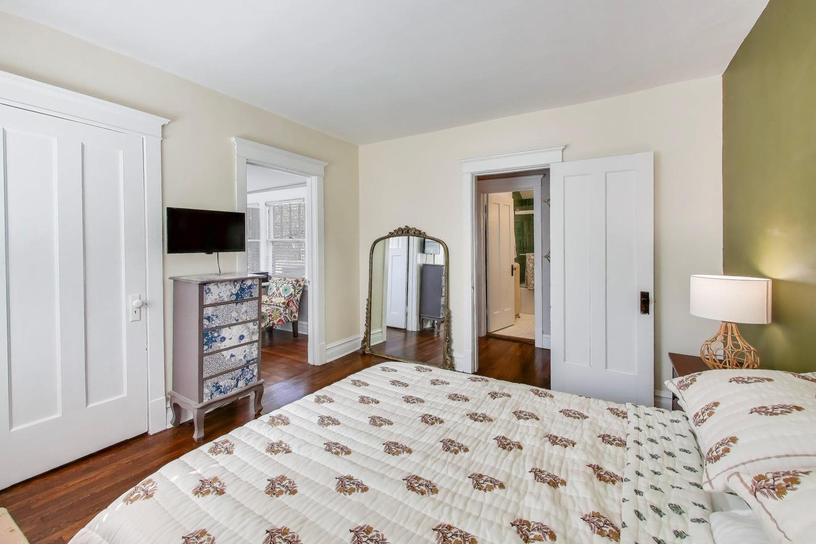 207 5th Street Wilmette, IL 60091 - Photo 21 of 30 a bedroom with a bed and a flat screen tv