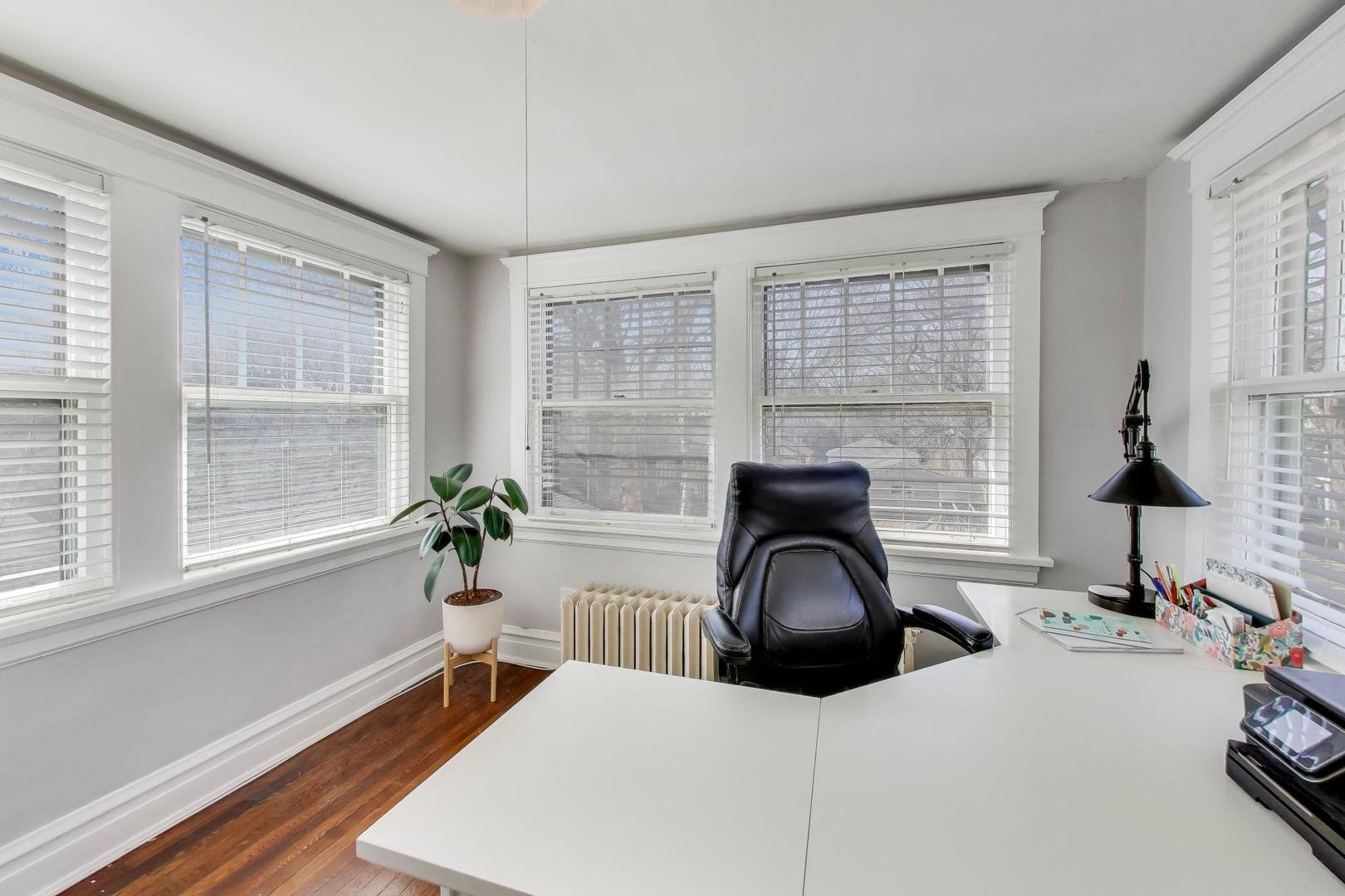 207 5th Street Wilmette, IL 60091 - Photo 22 of 30 a bedroom with a bed and a large window