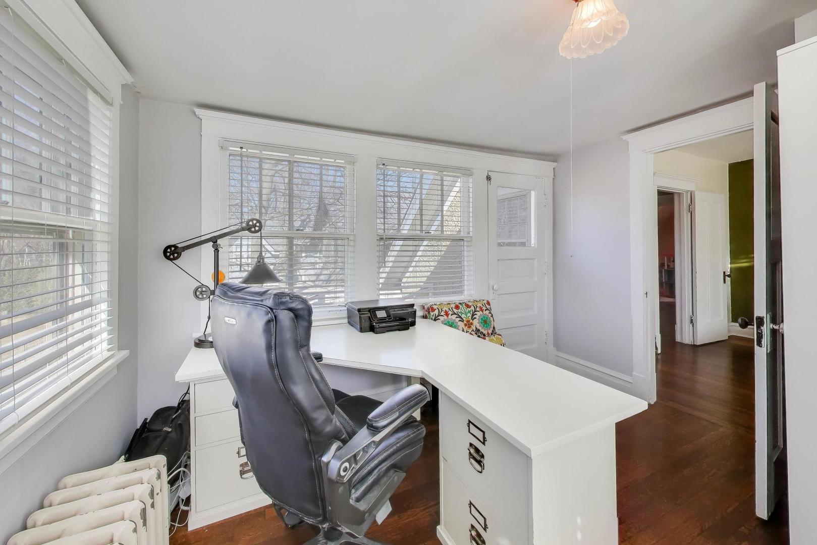 207 5th Street Wilmette, IL 60091 - Photo 23 of 30 a view of a dining room with furniture window and wooden floor