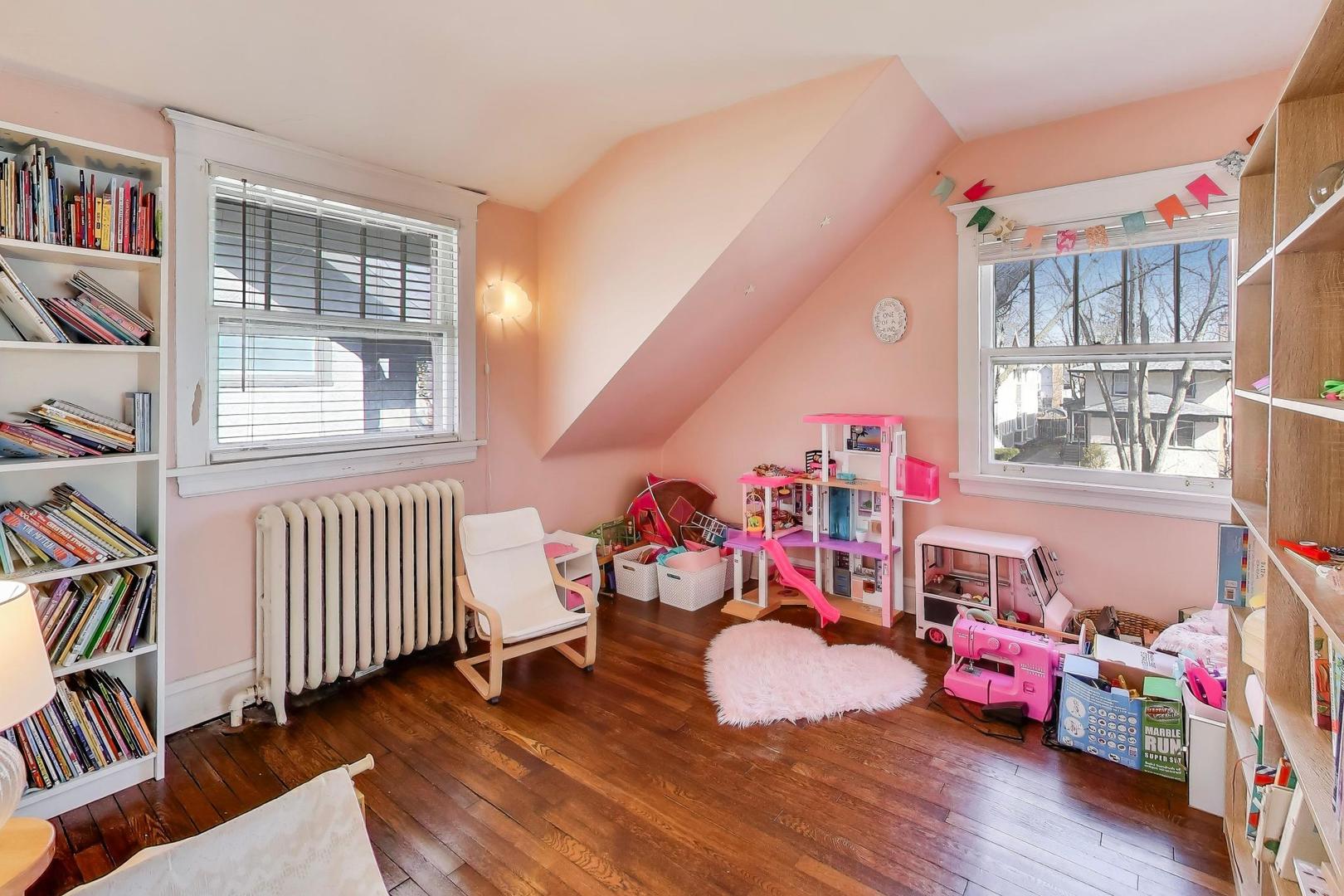 207 5th Street Wilmette, IL 60091 - Photo 24 of 30 a bedroom with furniture and a window