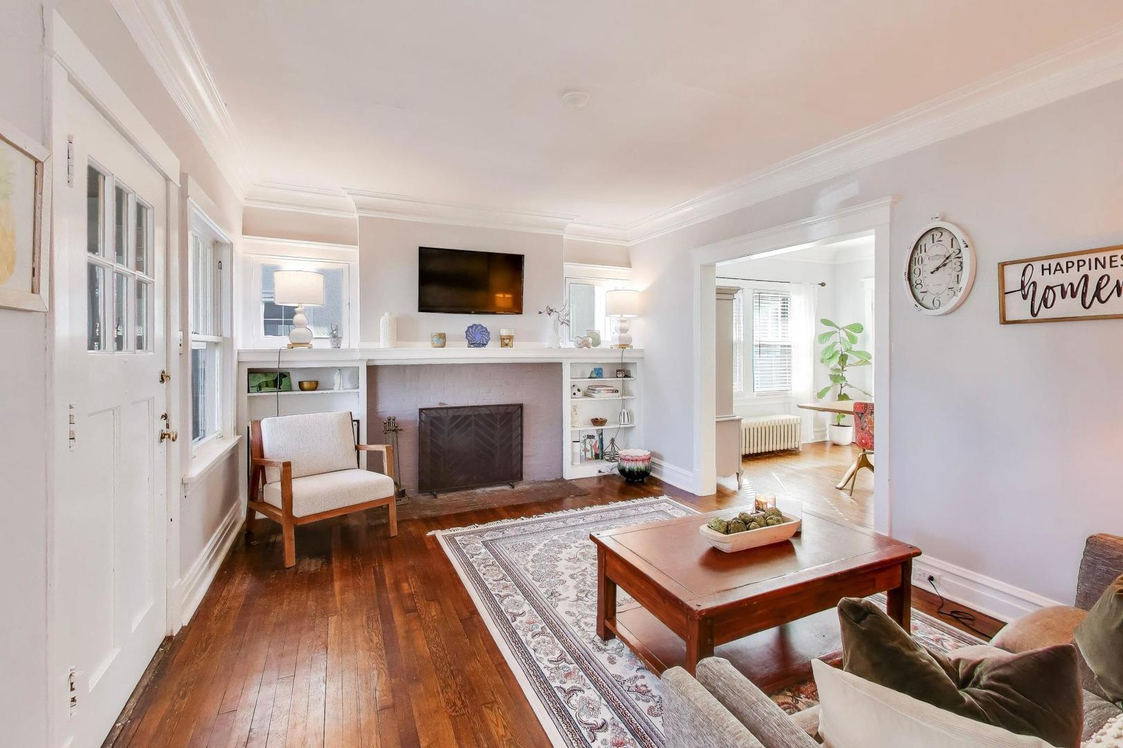 207 5th Street Wilmette, IL 60091 - Photo 4 of 30 a living room with furniture and a fireplace