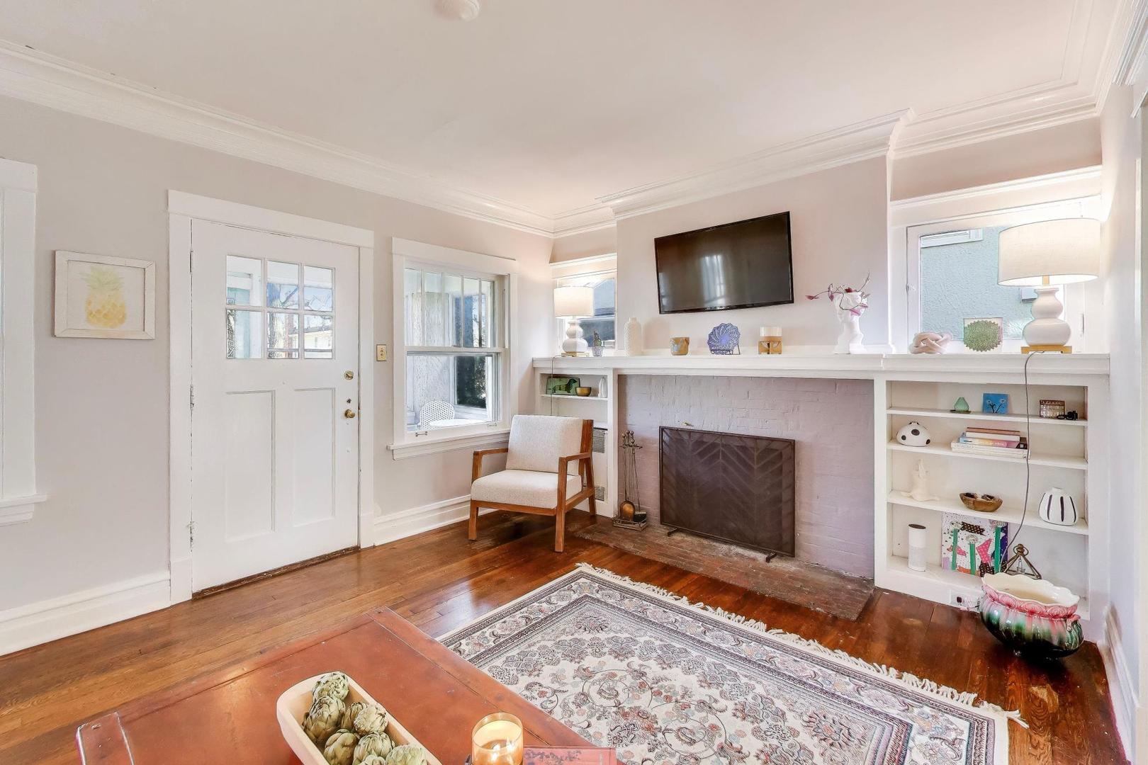 207 5th Street Wilmette, IL 60091 - Photo 5 of 30 a living room with furniture fireplace and flat screen tv